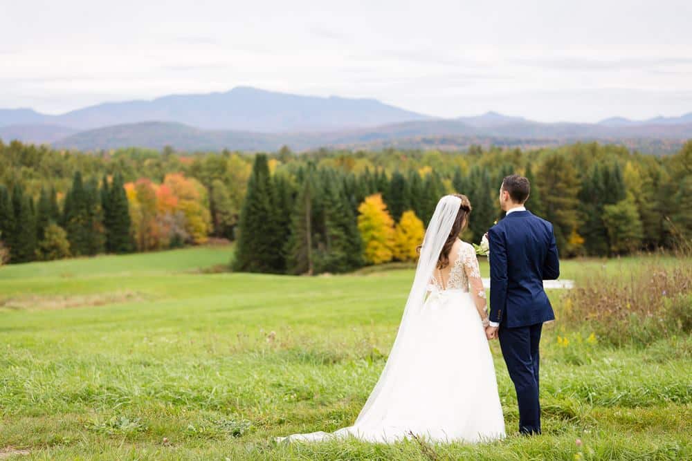 A wedding couple enjoying the view at The Inn at Grace Farm, Fairfax VT